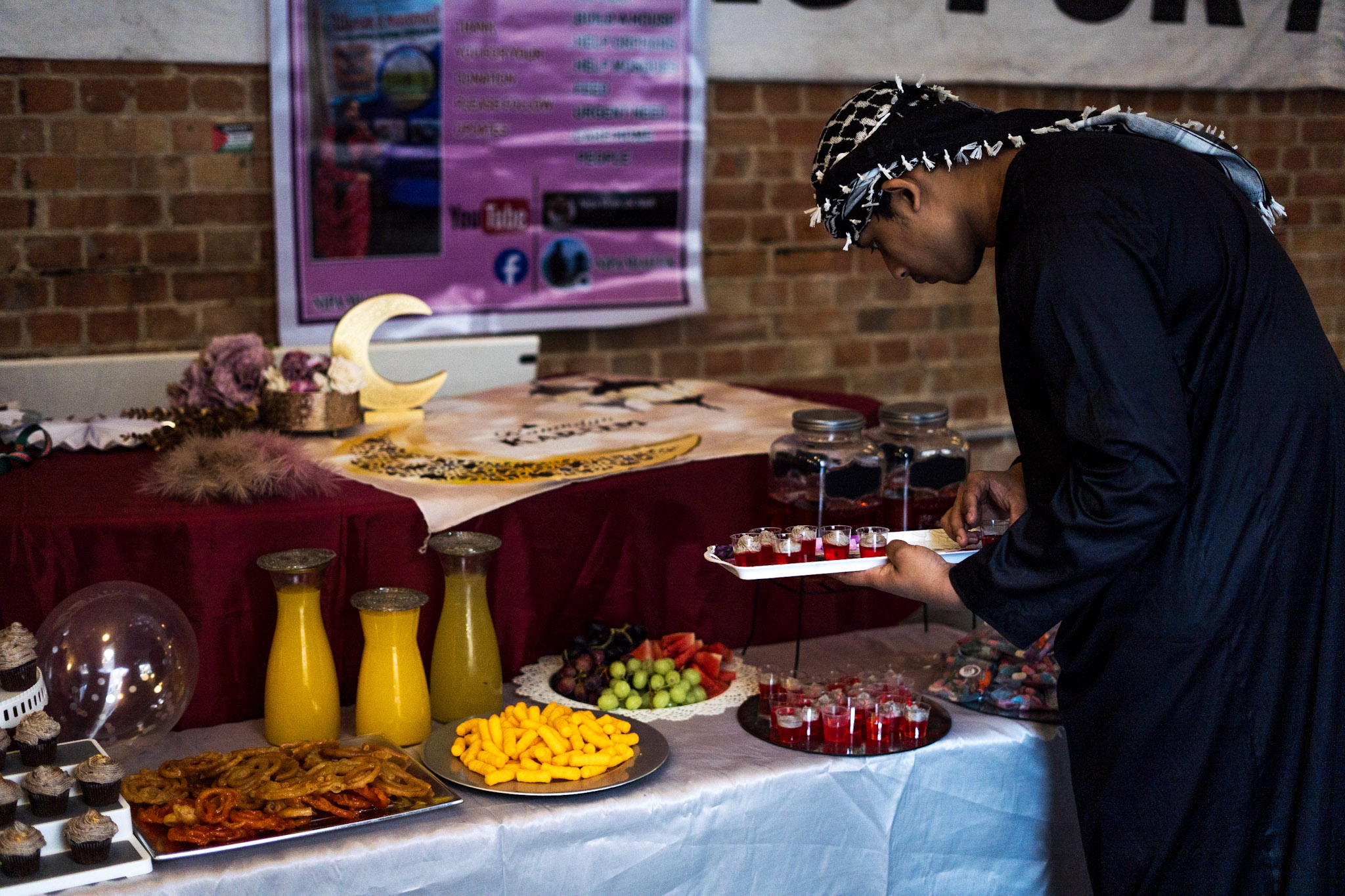 A man serving food at an Iftar meal